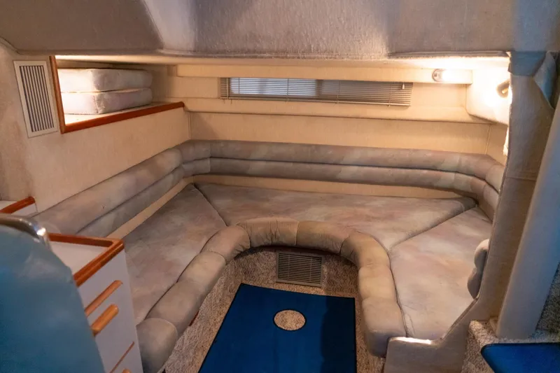 Slide: The Image of Interior cabin of a 1991 Sea Ray 350 Sundancer with cozy seating and soft lighting. - 29