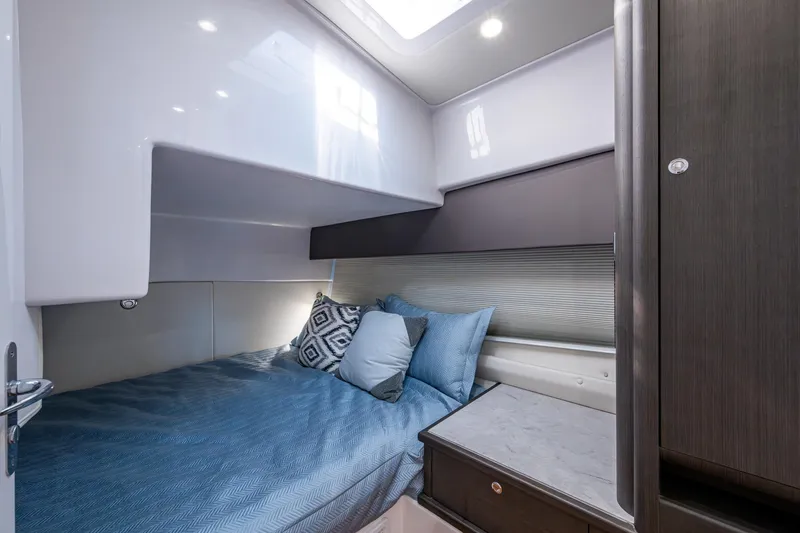 Slide: The Image of 2024 Intrepid 477 Evolution cabin interior with cozy bed and modern design. - 17
