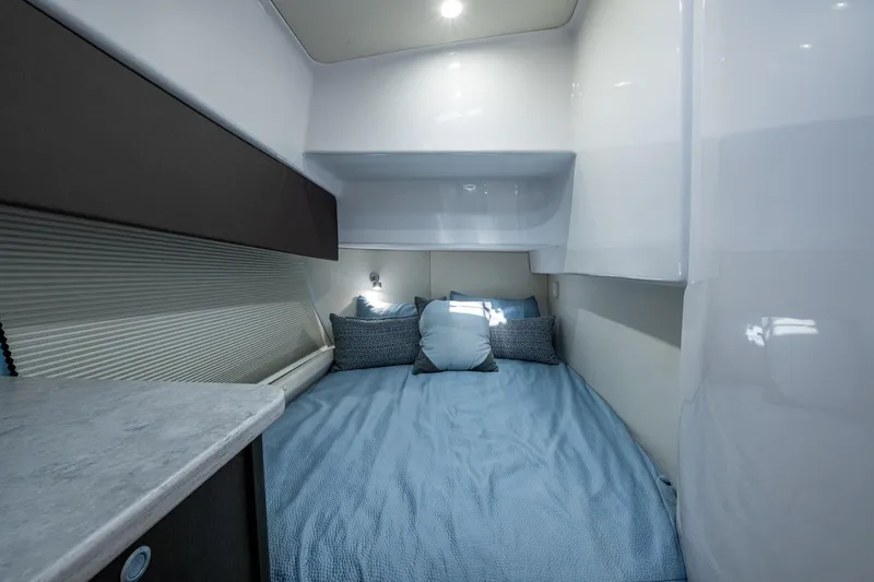 Slide: The Image of 2024 Intrepid 477 Evolution cabin interior with cozy bed and modern design. - 19