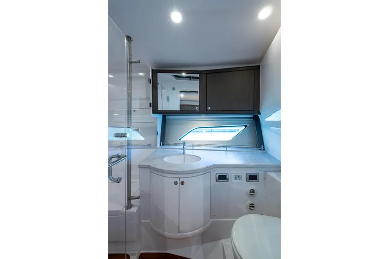 Slide: The Image of Luxurious bathroom interior of 2024 Intrepid 477 Evolution yacht with modern fixtures. - 20