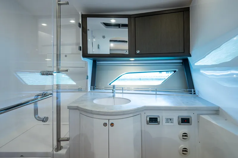 Slide: The Image of Luxurious bathroom interior of 2024 Intrepid 477 Evolution yacht with modern fixtures. - 21