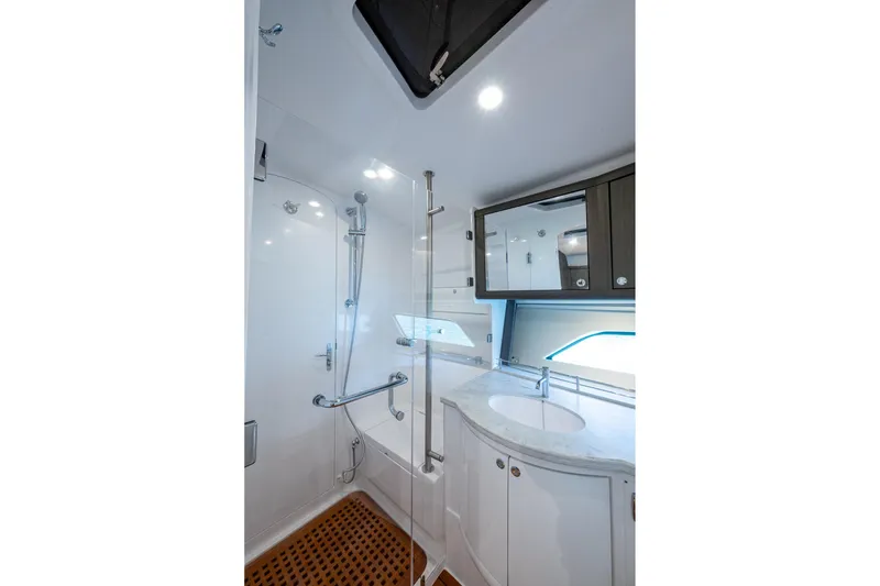 Slide: The Image of Luxurious bathroom in 2024 Intrepid 477 Evolution yacht with modern fixtures and elegant design. - 22