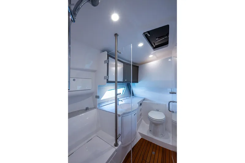 Slide: The Image of Luxurious bathroom in 2024 Intrepid 477 Evolution yacht with modern fixtures and wooden flooring. - 23