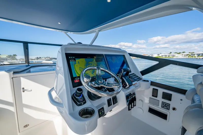 Slide: The Image of 2024 Intrepid 477 Evolution helm with advanced navigation displays and controls. - 25