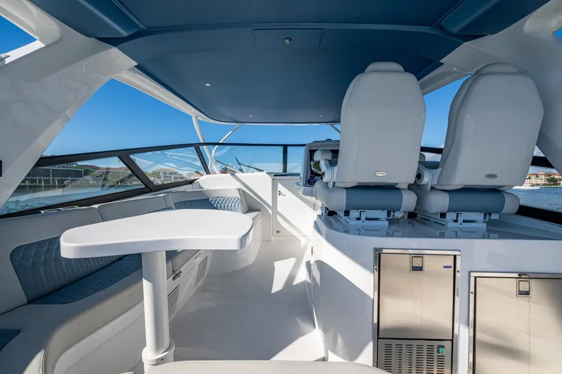 Slide: The Image of Luxurious interior of 2024 Intrepid 477 Evolution yacht with modern seating and sleek design. - 28