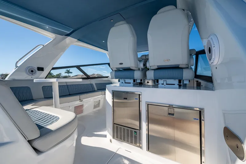 Slide: The Image of Luxurious interior of 2024 Intrepid 477 Evolution yacht with plush seating and modern amenities. - 29