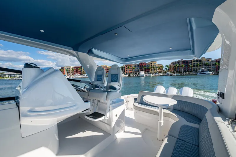 Slide: The Image of Luxurious 2024 Intrepid 477 Evolution yacht interior with waterfront view. - 31