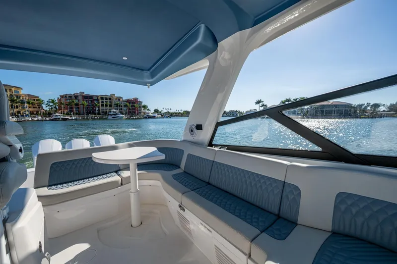 Slide: The Image of Luxurious interior of 2024 Intrepid 477 Evolution yacht with waterfront view. - 33