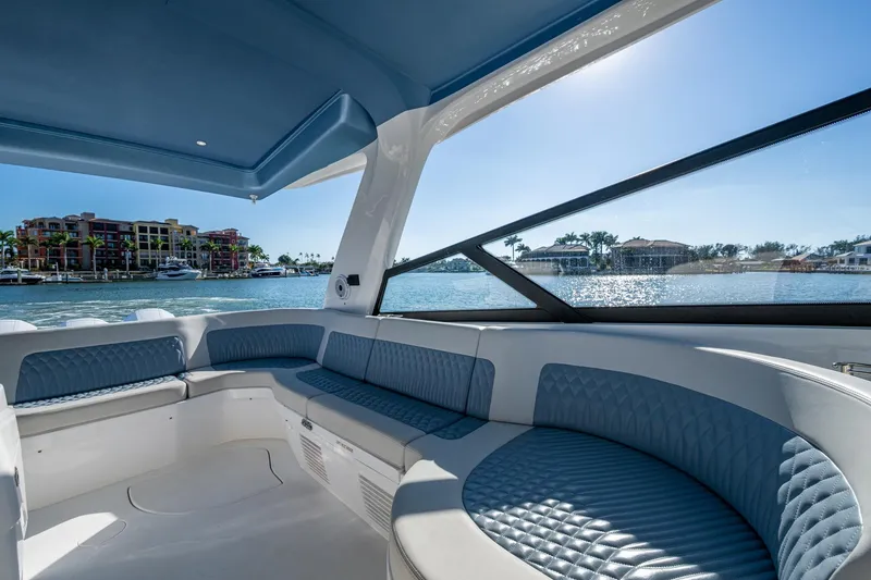 Slide: The Image of Luxurious interior of 2024 Intrepid 477 Evolution yacht with waterfront view. - 34