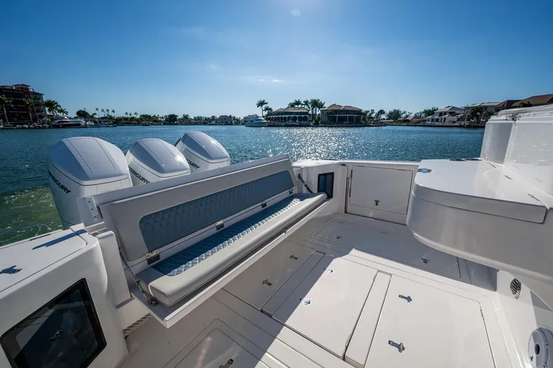 Slide: The Image of 2024 Intrepid 477 Evolution boat with triple Mercury engines on a sunny day. - 38