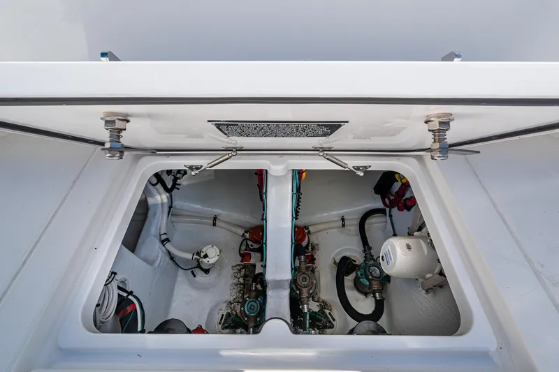Slide: The Image of Engine compartment of 2024 Intrepid 477 Evolution boat, showcasing mechanical components. - 40
