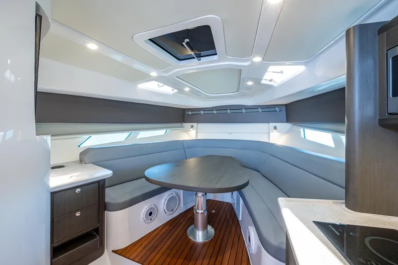 Slide: The Image of Luxurious interior of 2024 Intrepid 477 Evolution yacht with modern seating and sleek design. - 6