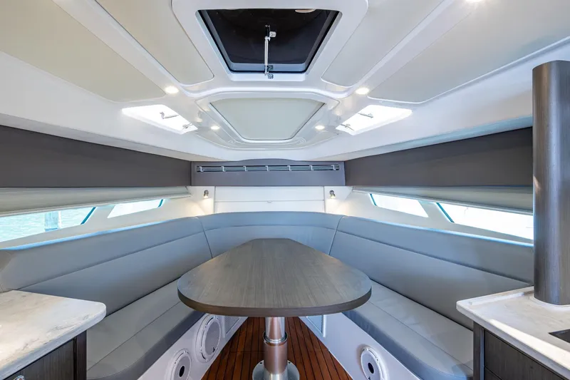 Slide: The Image of Luxurious interior of 2024 Intrepid 477 Evolution yacht with sleek seating and modern design. - 7