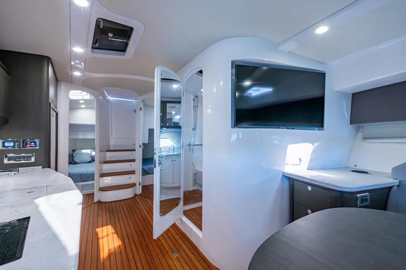 Slide: The Image of Luxurious interior of 2024 Intrepid 477 Evolution yacht with modern amenities and sleek design. - 8