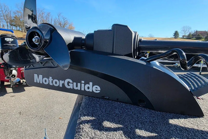 Slide: The Image of MotorGuide trolling motor on 2022 Lund 1675 Adventure SS boat, parked outdoors. - 12
