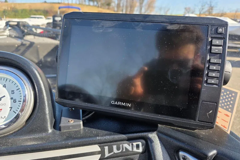 Slide: The Image of Garmin GPS on 2022 Lund 1675 Adventure SS boat dashboard with tachometer. - 16