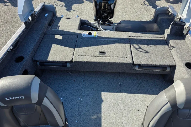 Slide: The Image of 2022 Lund 1675 Adventure SS boat interior with seating and storage compartments. - 17