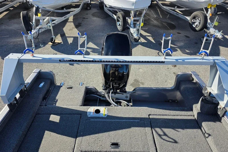 Slide: The Image of 2022 Lund 1675 Adventure SS boat interior with motor and trailer setup. - 19