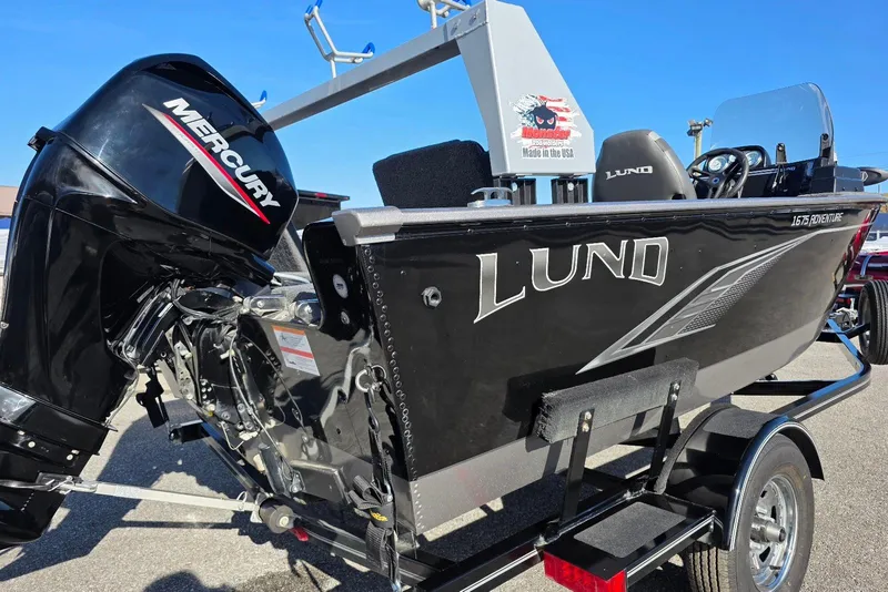 Slide: The Image of 2022 Lund 1675 Adventure SS boat with Mercury engine on trailer, outdoor display. - 5