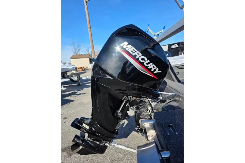 Slide: The Image of 2022 Lund 1675 Adventure SS with Mercury outboard motor in a sunny outdoor setting. - 6