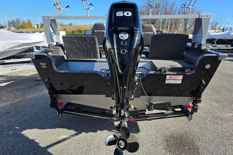 Slide: The Image of 2022 Lund 1675 Adventure SS boat with a 60 HP outboard motor, rear view. - 7