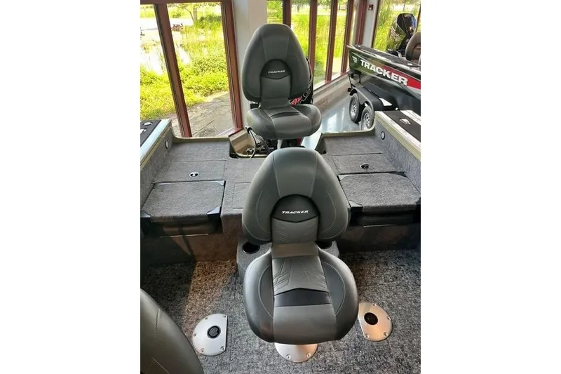 Slide: The Image of 2026 Tracker Targa V-18 Combo boat interior with two black seats. - 16