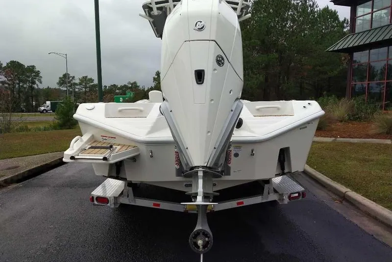 Slide: The Image of 2026 Ranger 2660 Bay boat on trailer, rear view, parked outdoors. - 3