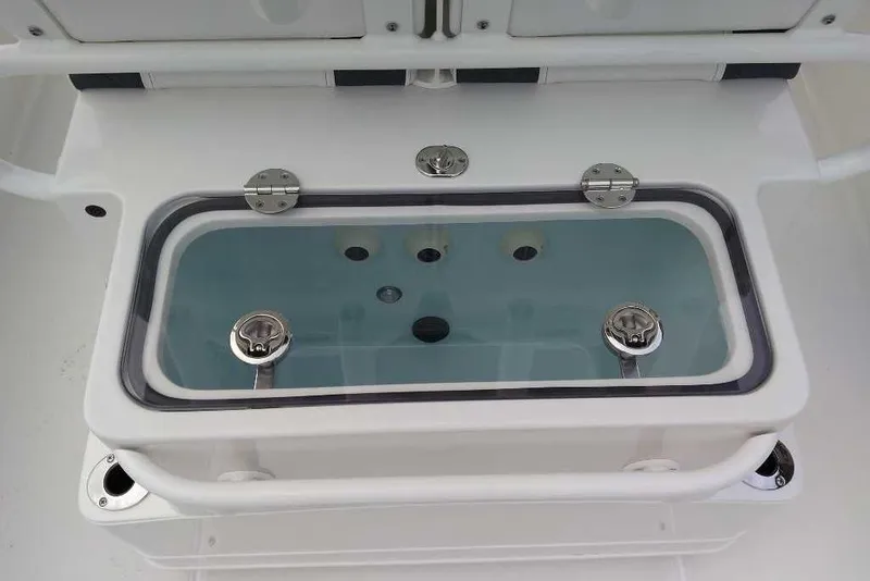 Slide: The Image of 2026 Ranger 2660 Bay boat livewell with clear lid and stainless steel fittings. - 5