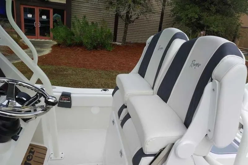 Slide: The Image of 2026 Ranger 2660 Bay boat interior with dual seats and steering wheel. - 6