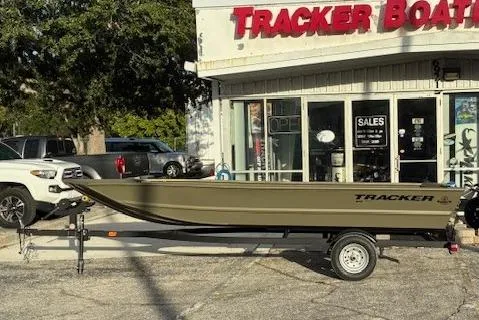 The Image of 2026 Tracker Grizzly 1648 Utility boat on trailer outside dealership. - 0