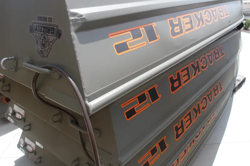 The Image of 2026 Tracker Grizzly 12 Jon boat, stacked, showcasing branding and design details. - 0