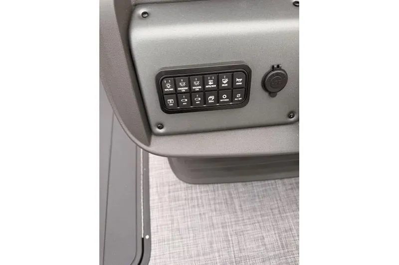 Slide: The Image of Control panel of 2026 Sun Tracker SportFish 22 XP3 boat, featuring various function buttons. - 9