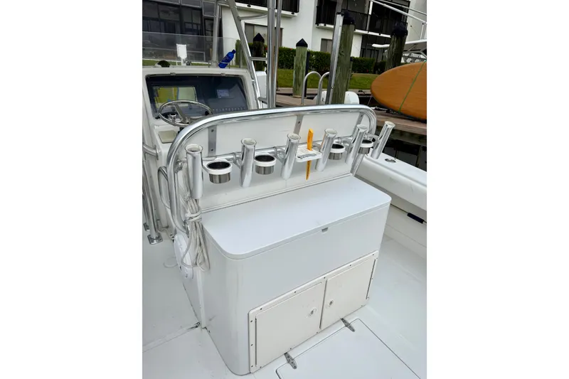 Slide: The Image of 2005 Jupiter 31 Center Console boat with rod holders and storage compartments. - 14