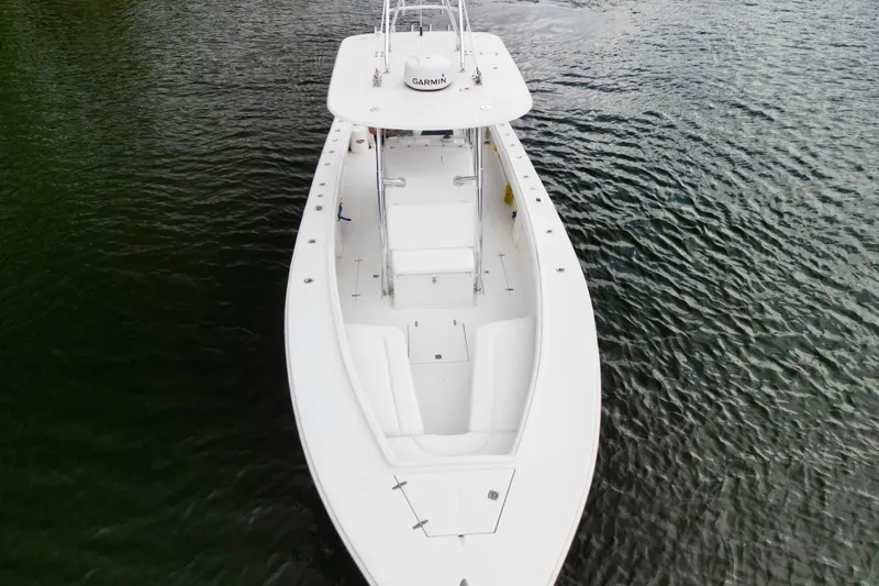 Slide: The Image of 2005 Jupiter 31 Center Console boat on calm water, aerial view. - 21