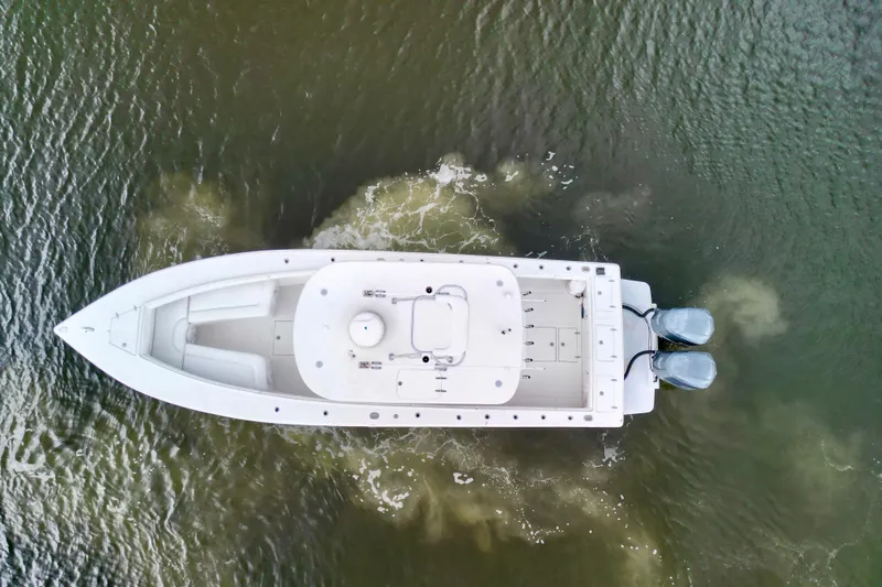 Slide: The Image of Aerial view of 2005 Jupiter 31 Center Console boat on water. - 5