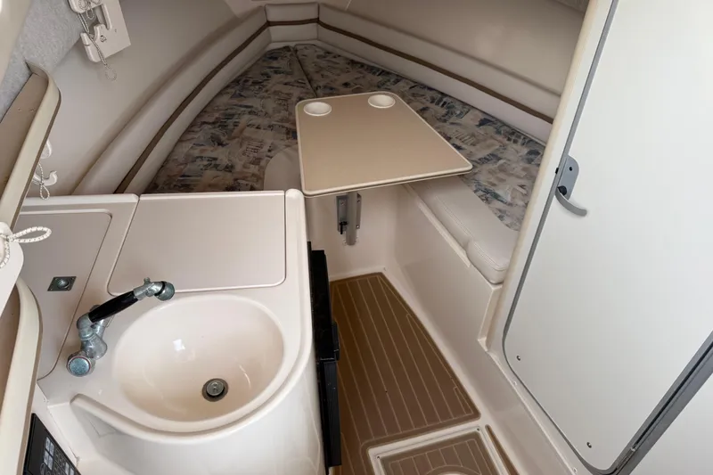 Slide: The Image of 2002 Grady-White Sailfish 282 boat interior with storage compartment and speaker. - 11