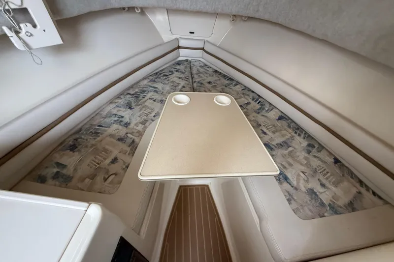 Slide: The Image of 2002 Grady-White Sailfish 282 boat on stands, surrounded by other vessels. - 24