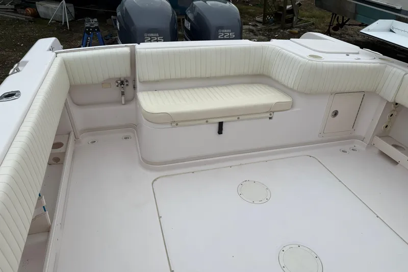 Slide: The Image of 2002 Grady-White Sailfish 282 with twin Yamaha 225 engines, docked on land. - 3