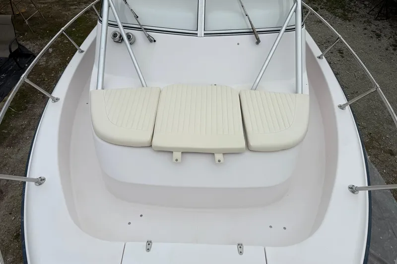 Slide: The Image of 2002 Grady-White Sailfish 282 boat on stands, clear blue sky background. - 30