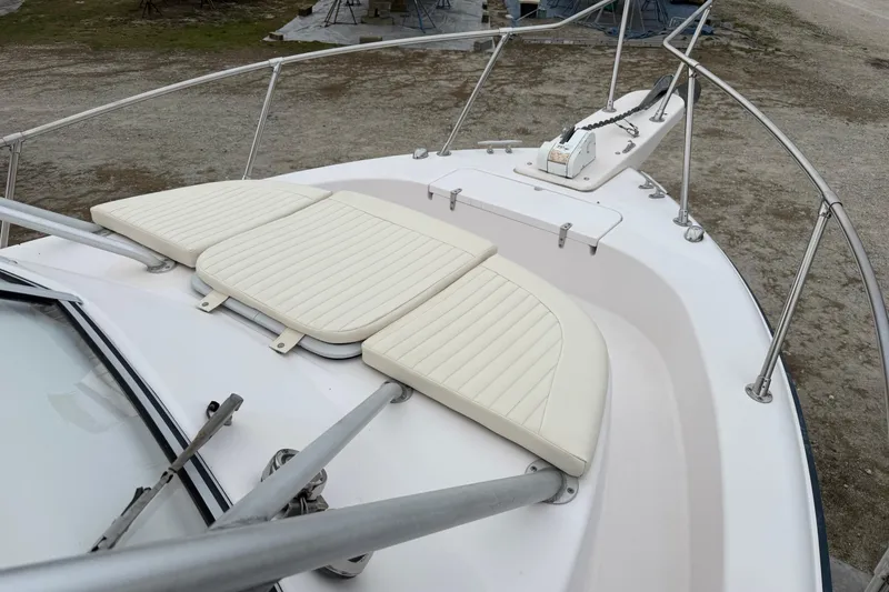 Slide: The Image of 2002 Grady-White Sailfish 282 boat with Yamaha engine, docked under clear blue sky. - 31