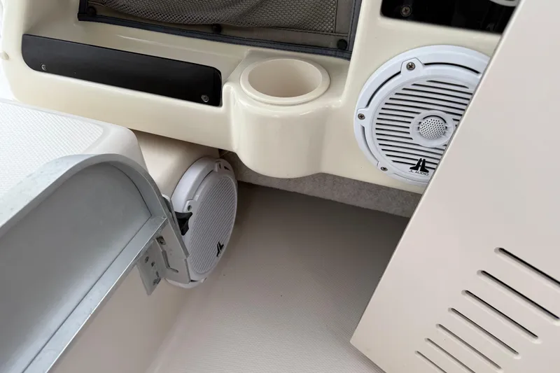 Slide: The Image of 2002 Grady-White Sailfish 282 boat deck with seating, docked in a marina. - 6