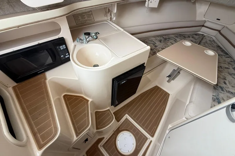 Slide: The Image of 2002 Grady-White Sailfish 282 boat with Icom marine radio and Sea Tow sticker. - 9