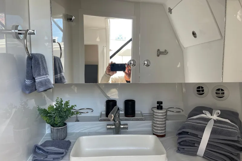 Slide: The Image of Modern bathroom interior of 2026 Everglades 367 CX boat, featuring sleek design and elegant accessories. - 14