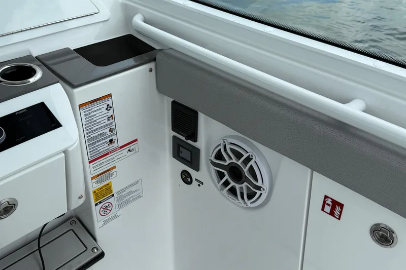 Slide: The Image of Interior of 2026 Everglades 367 CX boat with speaker and control panel. - 22