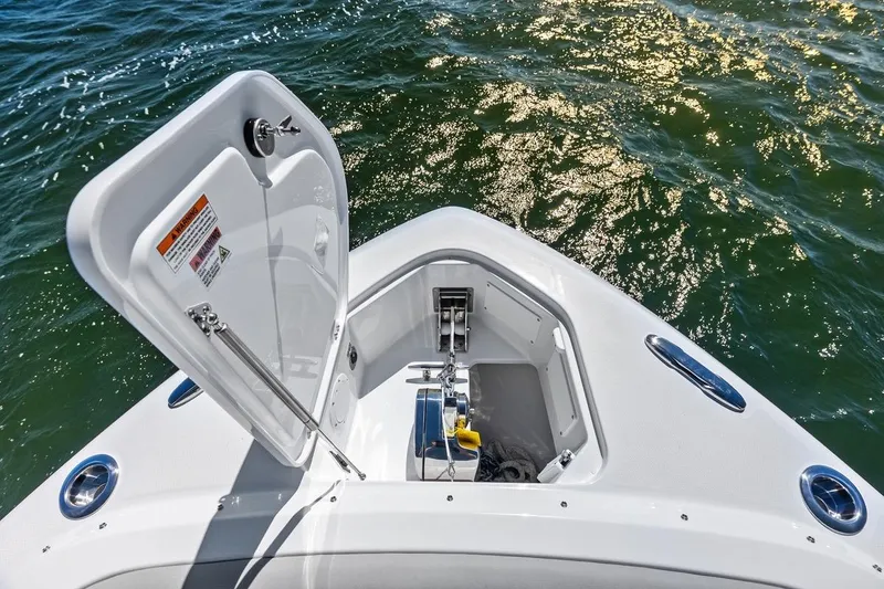 Slide: The Image of Bow of 2026 Everglades 367 CX boat with open anchor hatch on water. - 3