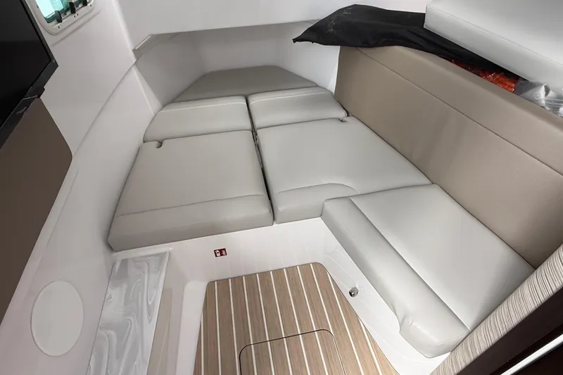 Slide: The Image of 2026 Everglades 367 CX cabin interior with cushioned seating and wood flooring. - 39