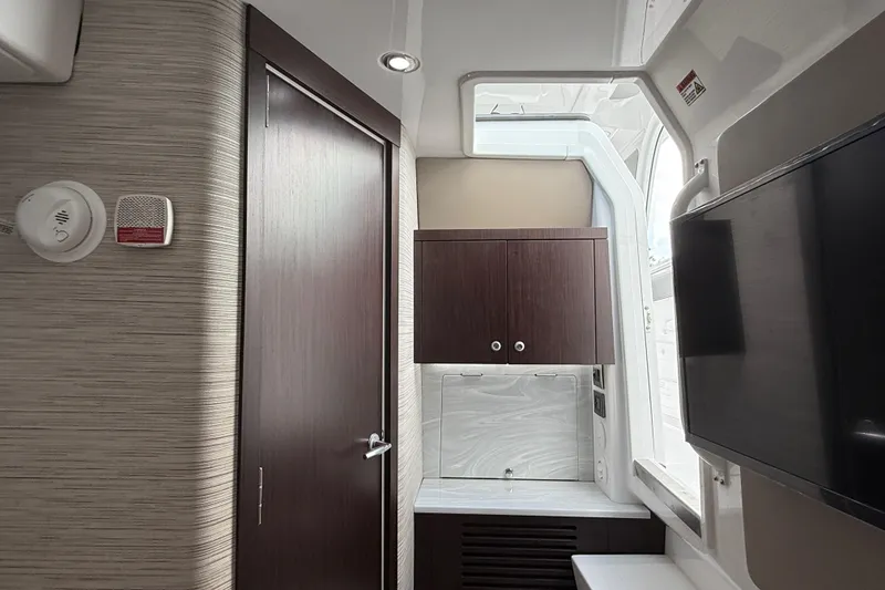 Slide: The Image of Interior of 2026 Everglades 367 CX boat, featuring modern cabinetry and sleek design. - 42