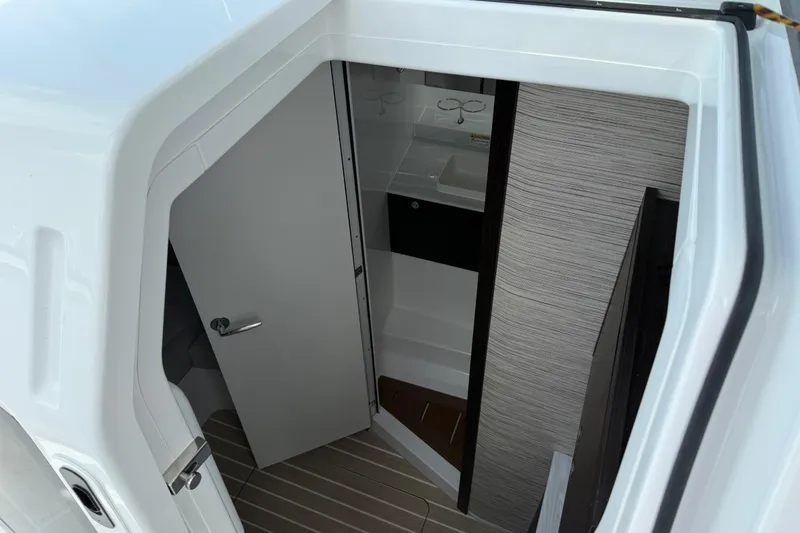 Slide: The Image of 2026 Everglades 367 CX boat interior cabin with open door and modern design. - 43