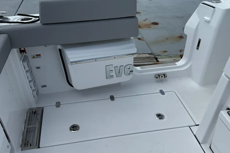 Slide: The Image of 2026 Everglades 367 CX boat interior with seating and storage compartments. - 49