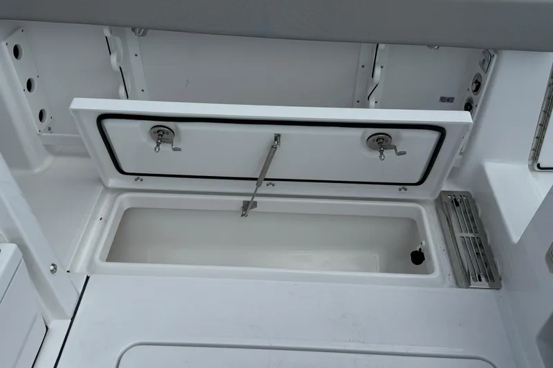 Slide: The Image of Open storage compartment on 2026 Everglades 367 CX boat, showcasing interior space. - 51